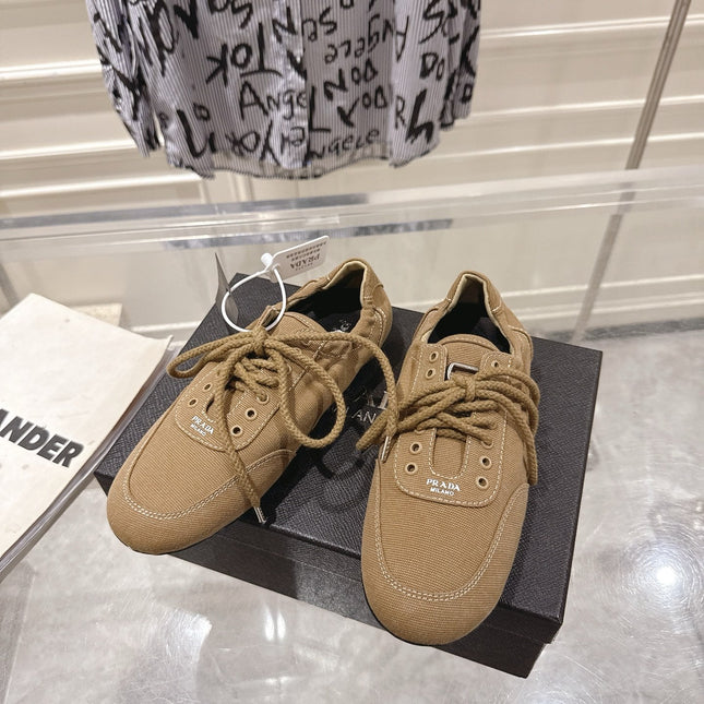 PRADA 26S COLLAPSE SNEAKERS IN BROWN CANVAS