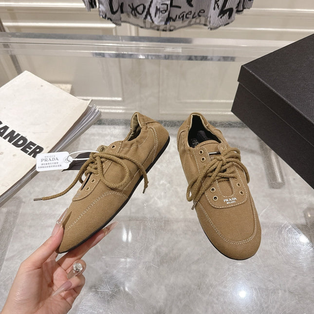 PRADA 26S COLLAPSE SNEAKERS IN BROWN CANVAS