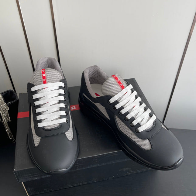 PRADA 26S AMERICA CUP SNEAKERS IN BLACK SOFT RUBBER AND BIKE FABRIC