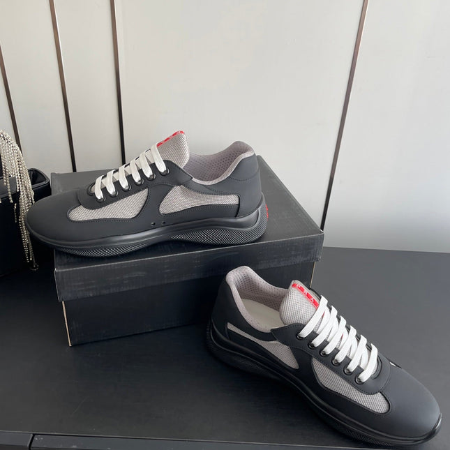 PRADA 26S AMERICA CUP SNEAKERS IN BLACK SOFT RUBBER AND BIKE FABRIC