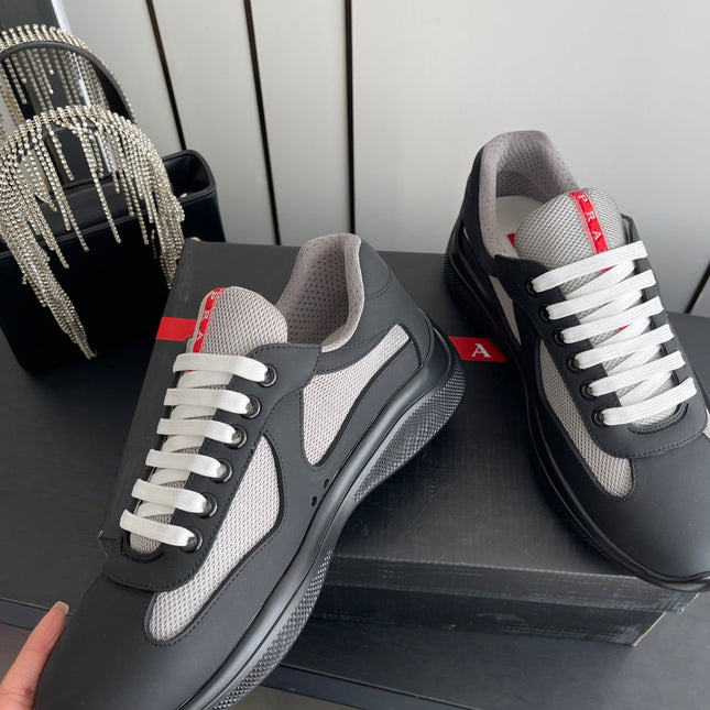 PRADA 26S AMERICA CUP SNEAKERS IN BLACK SOFT RUBBER AND BIKE FABRIC