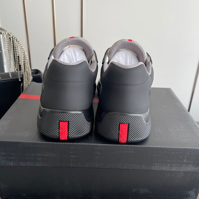 PRADA 26S AMERICA CUP SNEAKERS IN BLACK SOFT RUBBER AND BIKE FABRIC