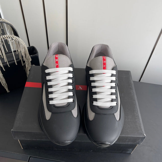 PRADA 26S AMERICA CUP SNEAKERS IN BLACK SOFT RUBBER AND BIKE FABRIC