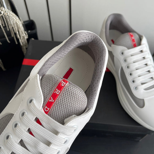 PRADA 26S AMERICA CUP SNEAKERS IN WHITE SOFT RUBBER AND BIKE FABRIC