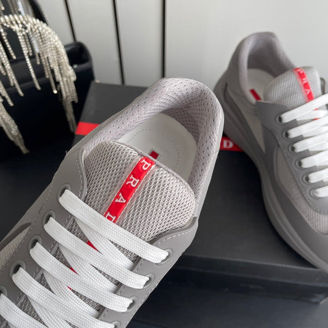 PRADA 26S AMERICA CUP SNEAKERS IN COOL GRAY SOFT RUBBER AND BIKE FABRIC