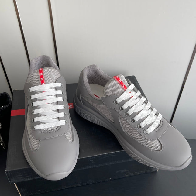 PRADA 26S AMERICA CUP SNEAKERS IN COOL GRAY SOFT RUBBER AND BIKE FABRIC
