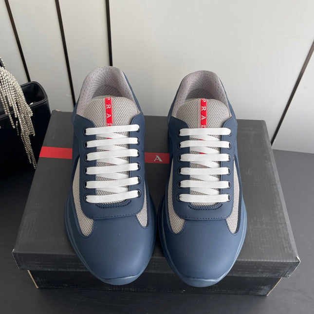 PRADA 26S AMERICA CUP SNEAKERS IN SLATE BLUE SOFT RUBBER AND BIKE FABRIC
