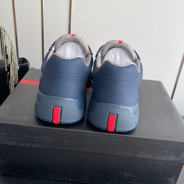 PRADA 26S AMERICA CUP SNEAKERS IN SLATE BLUE SOFT RUBBER AND BIKE FABRIC