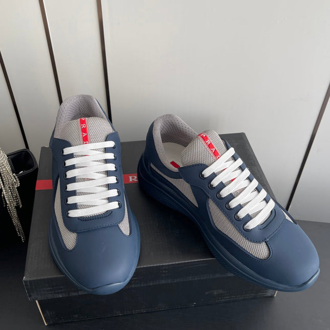 PRADA 26S AMERICA CUP SNEAKERS IN SLATE BLUE SOFT RUBBER AND BIKE FABRIC