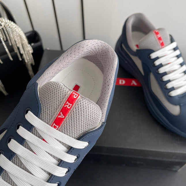 PRADA 26S AMERICA CUP SNEAKERS IN SLATE BLUE SOFT RUBBER AND BIKE FABRIC