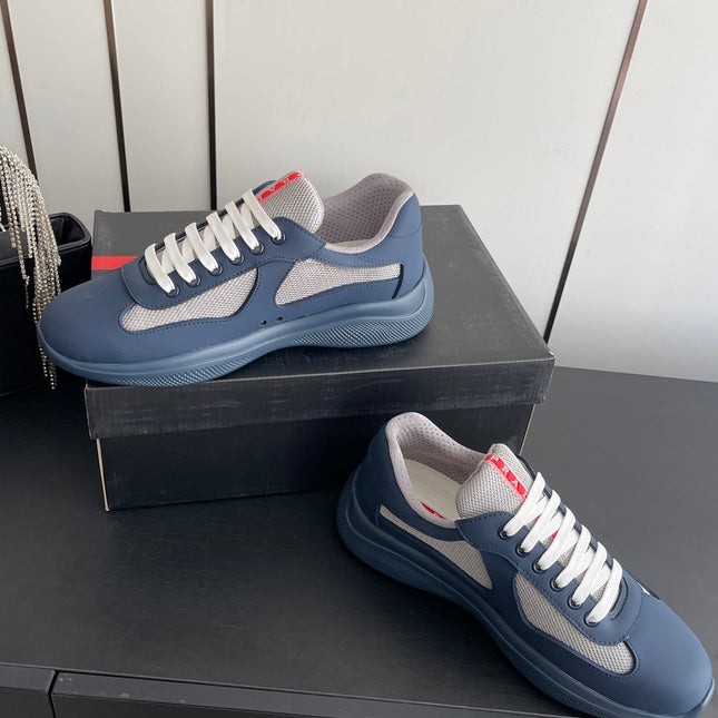 PRADA 26S AMERICA CUP SNEAKERS IN SLATE BLUE SOFT RUBBER AND BIKE FABRIC