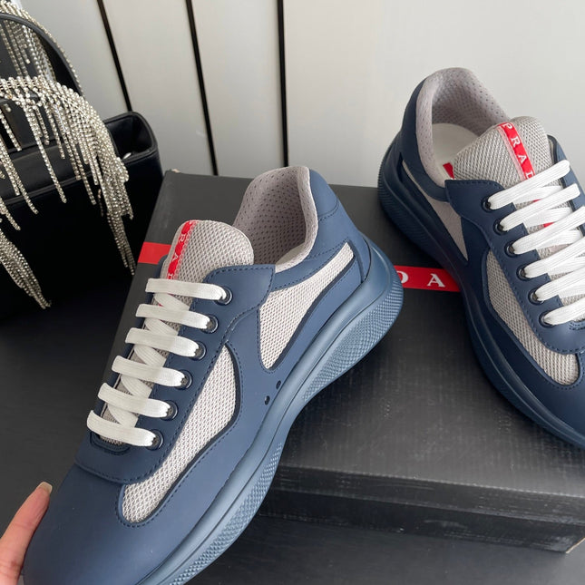 PRADA 26S AMERICA CUP SNEAKERS IN SLATE BLUE SOFT RUBBER AND BIKE FABRIC