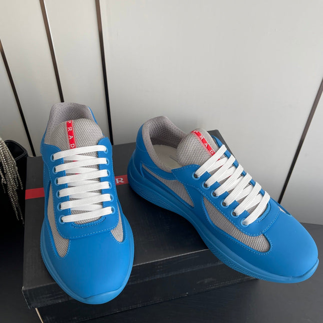 PRADA 26S AMERICA CUP SNEAKERS IN AZURE BLUE SOFT RUBBER AND BIKE FABRIC