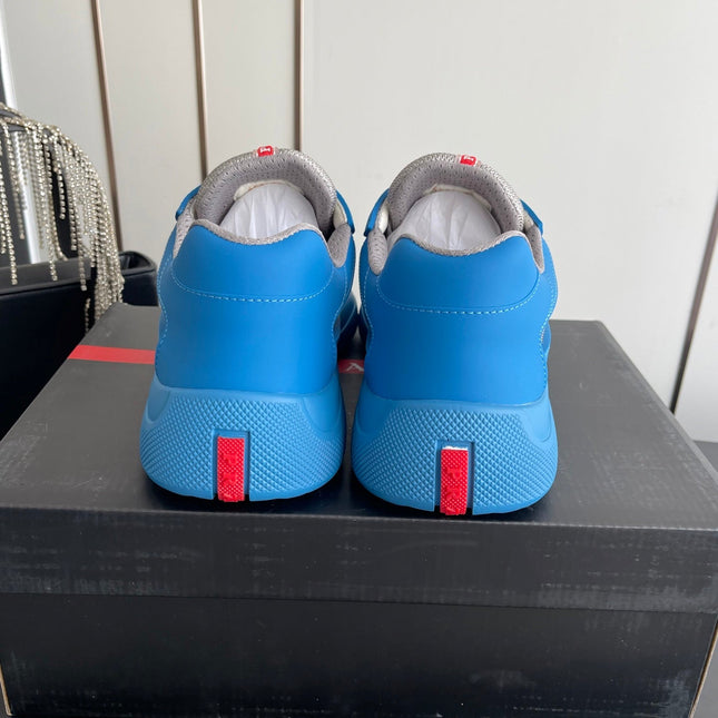PRADA 26S AMERICA CUP SNEAKERS IN AZURE BLUE SOFT RUBBER AND BIKE FABRIC