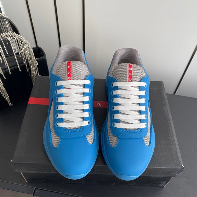 PRADA 26S AMERICA CUP SNEAKERS IN AZURE BLUE SOFT RUBBER AND BIKE FABRIC