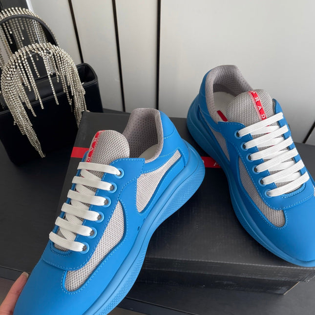 PRADA 26S AMERICA CUP SNEAKERS IN AZURE BLUE SOFT RUBBER AND BIKE FABRIC
