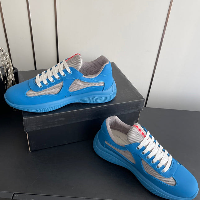 PRADA 26S AMERICA CUP SNEAKERS IN AZURE BLUE SOFT RUBBER AND BIKE FABRIC