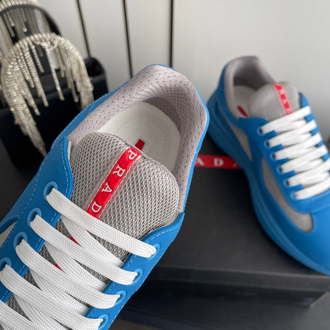 PRADA 26S AMERICA CUP SNEAKERS IN AZURE BLUE SOFT RUBBER AND BIKE FABRIC