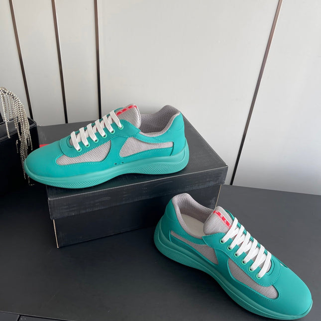 PRADA 26S AMERICA CUP SNEAKERS IN TEAL BLUE SOFT RUBBER AND BIKE FABRIC