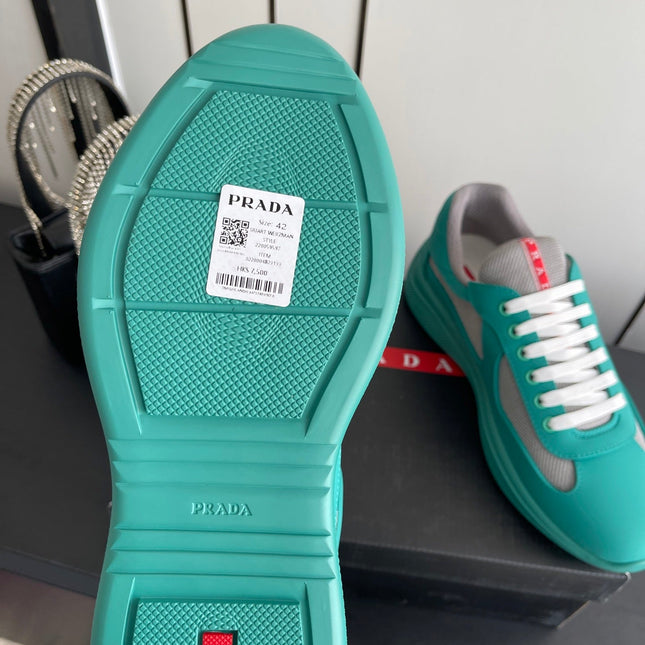 PRADA 26S AMERICA CUP SNEAKERS IN TEAL BLUE SOFT RUBBER AND BIKE FABRIC
