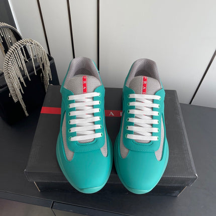 PRADA 26S AMERICA CUP SNEAKERS IN TEAL BLUE SOFT RUBBER AND BIKE FABRIC