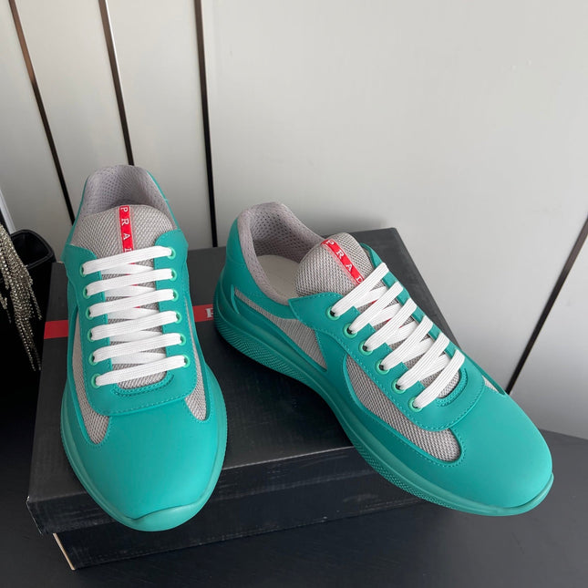 PRADA 26S AMERICA CUP SNEAKERS IN TEAL BLUE SOFT RUBBER AND BIKE FABRIC