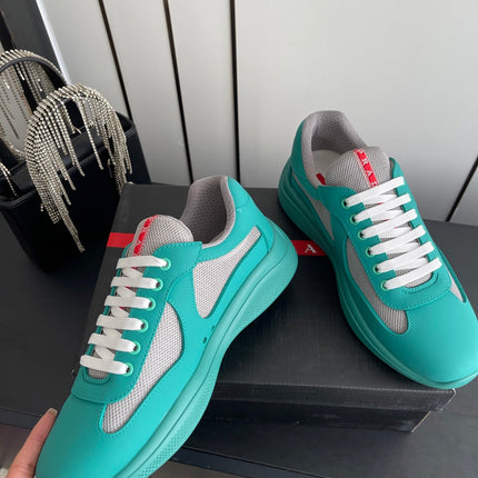 PRADA 26S AMERICA CUP SNEAKERS IN TEAL BLUE SOFT RUBBER AND BIKE FABRIC