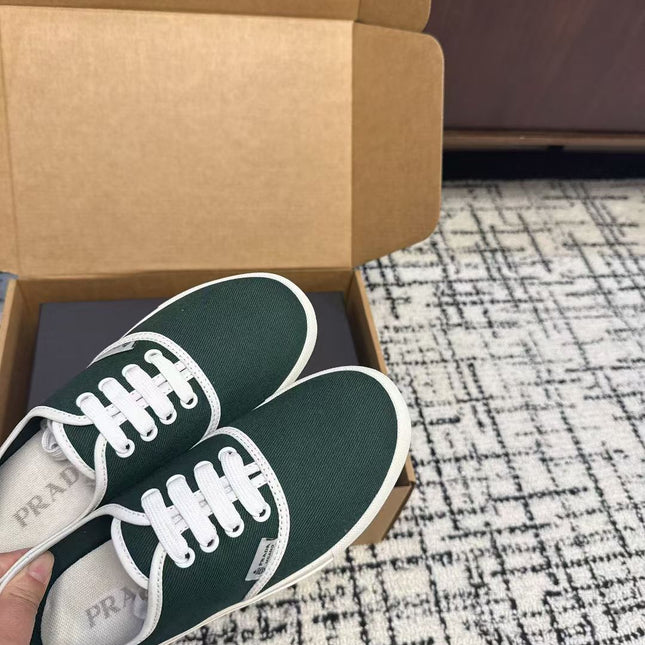 PRADA 26S LACE UP SNEAKERS IN DARK TEAL CANVAS