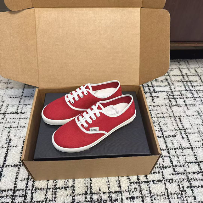 PRADA 26S LACE UP SNEAKERS IN RED CANVAS