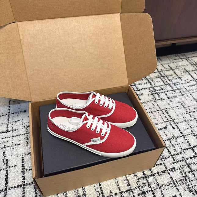 PRADA 26S LACE UP SNEAKERS IN RED CANVAS