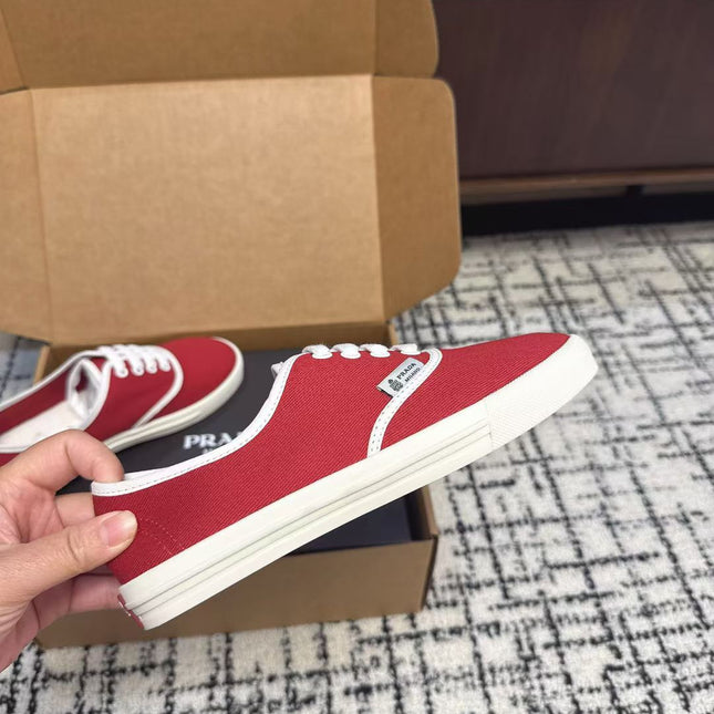 PRADA 26S LACE UP SNEAKERS IN RED CANVAS