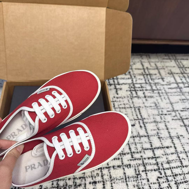 PRADA 26S LACE UP SNEAKERS IN RED CANVAS