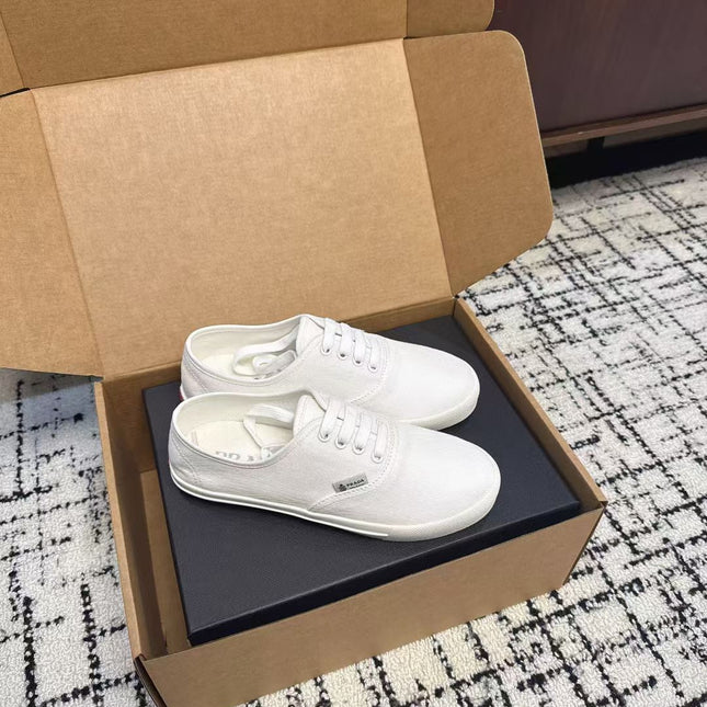 PRADA 26S LACE UP SNEAKERS IN WHITE CANVAS