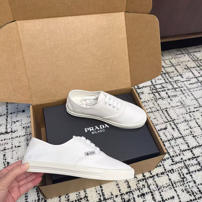 PRADA 26S LACE UP SNEAKERS IN WHITE CANVAS