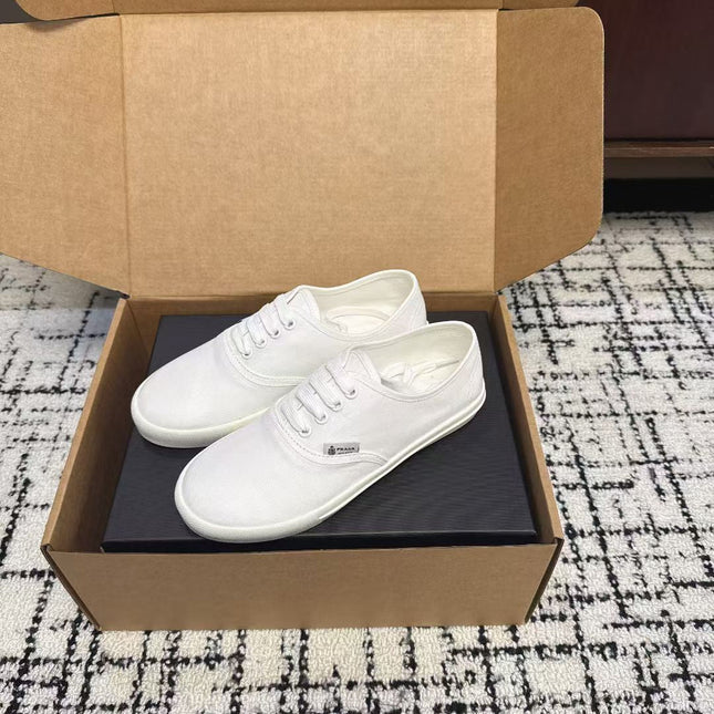 PRADA 26S LACE UP SNEAKERS IN WHITE CANVAS