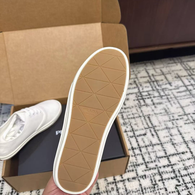 PRADA 26S LACE UP SNEAKERS IN WHITE CANVAS