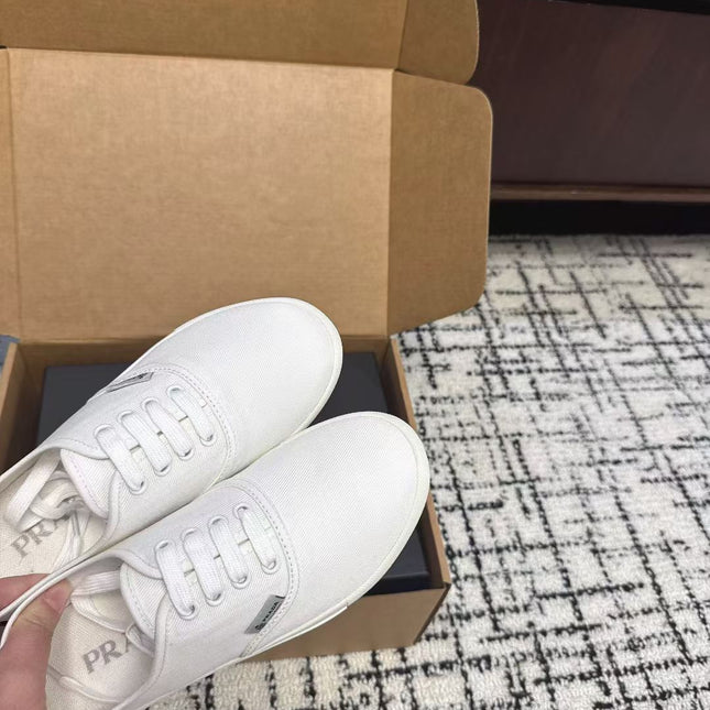 PRADA 26S LACE UP SNEAKERS IN WHITE CANVAS