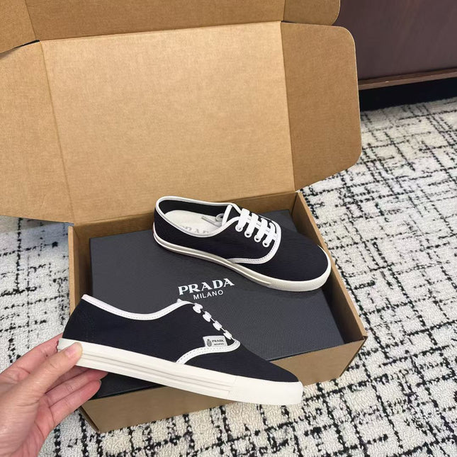 PRADA 26S LACE UP SNEAKERS IN BLACK AND WHITE CANVAS