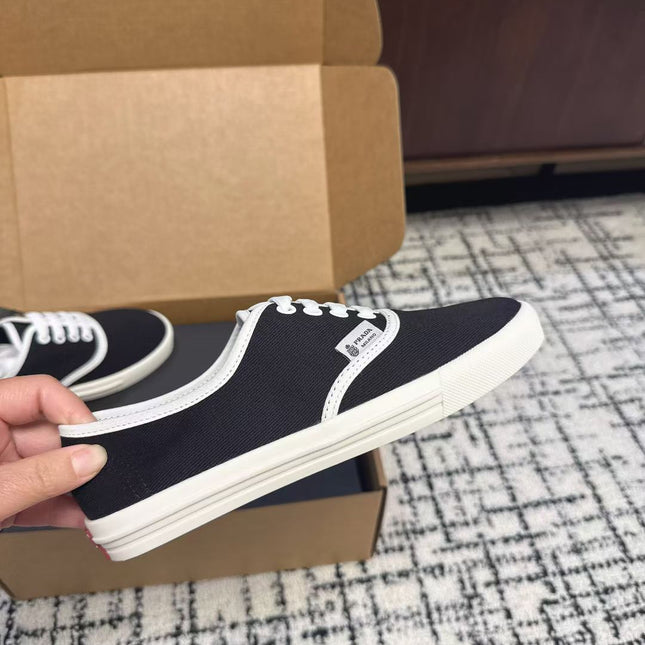 PRADA 26S LACE UP SNEAKERS IN BLACK AND WHITE CANVAS