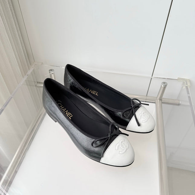CHANEL 26S BALLET FLATS IN BLACK CRACKED CALFSKIN WITH WHITE TOE CAP AND BOW