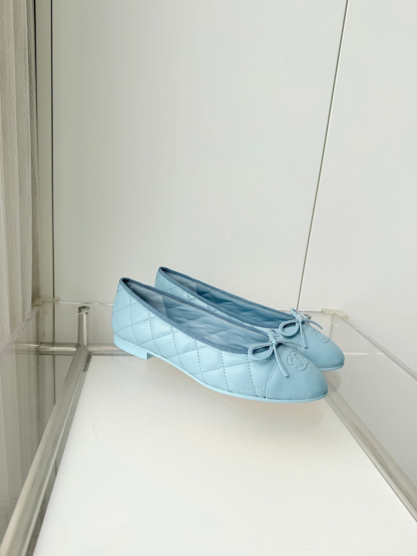 CHANEL 26S BALLET FLATS IN LIGHT BLUE QUILTED CALFSKIN WITH BOW