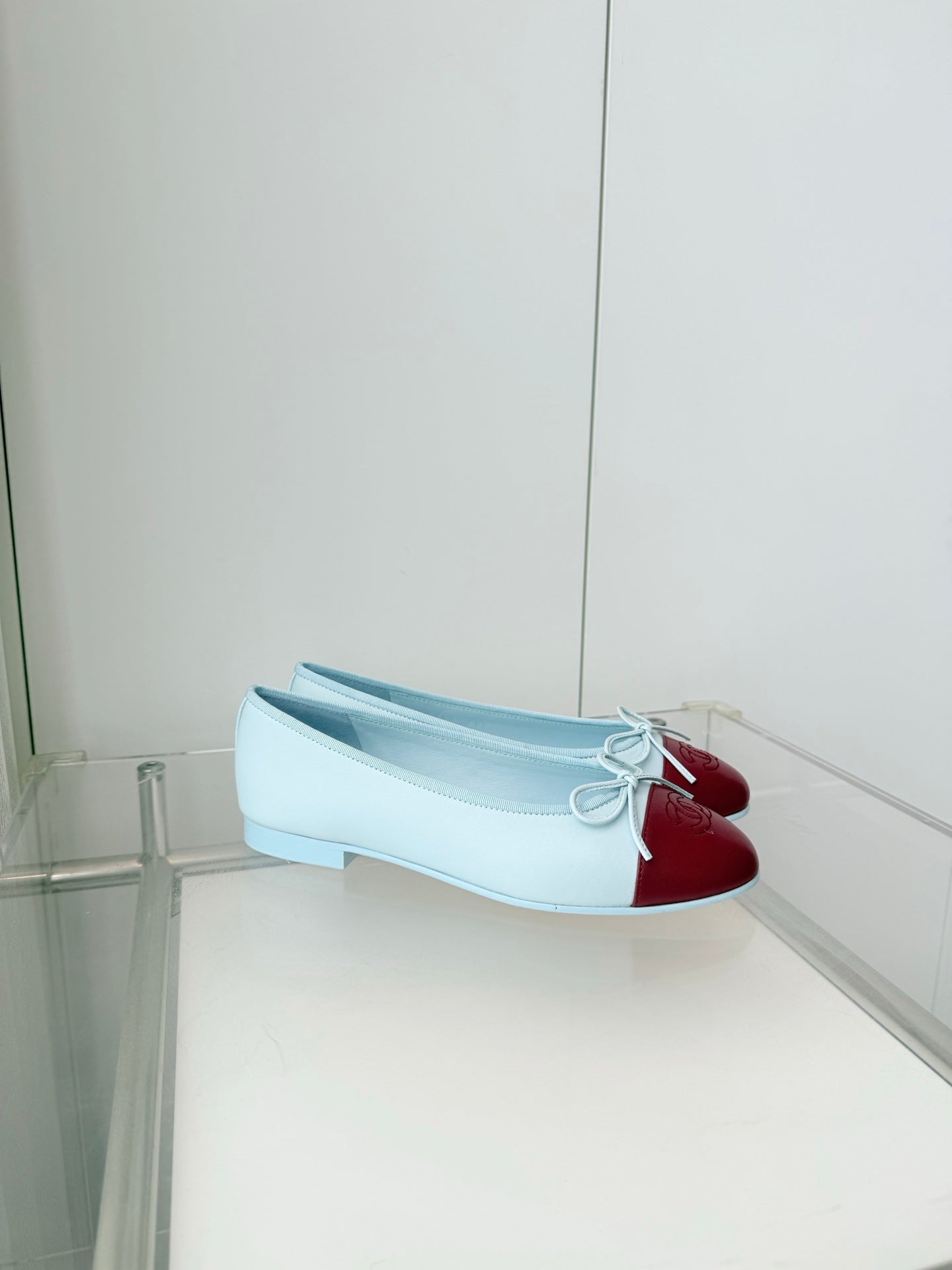 CHANEL 26S BALLET FLATS IN LIGHT BLUE CALFSKIN WITH BURGUNDY RED PATENT TOE CAP & BOW