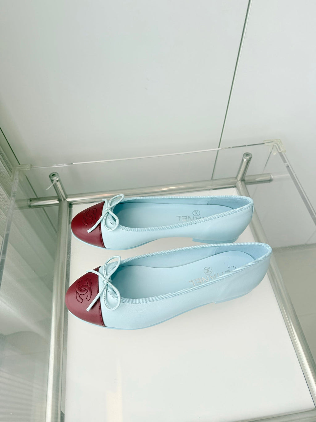 CHANEL 26S BALLET FLATS IN LIGHT BLUE CALFSKIN WITH BURGUNDY RED PATENT TOE CAP & BOW