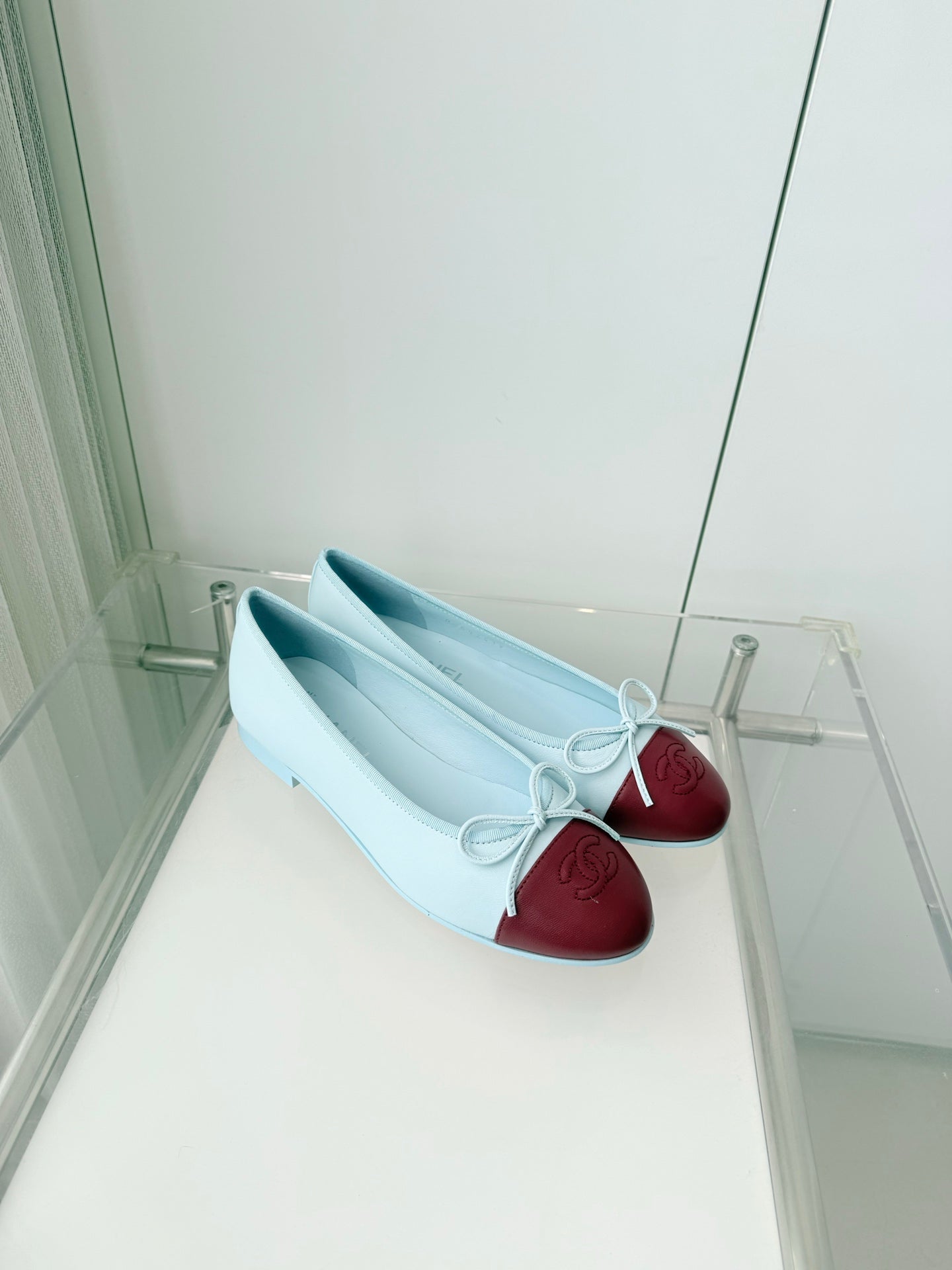 CHANEL 26S BALLET FLATS IN LIGHT BLUE CALFSKIN WITH BURGUNDY RED PATENT TOE CAP & BOW