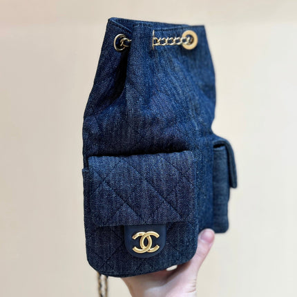 DRAWSTRING BUCKET BACKPACK 24 IN DARK BLUE DENIM GOLD HARDWARE