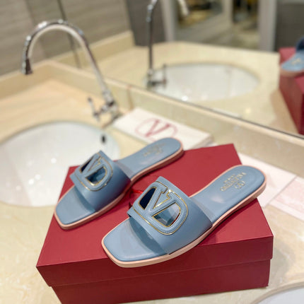 VALENTINO 26S SLIDES IN PASTEL BLUE CALFSKIN WITH LOGO