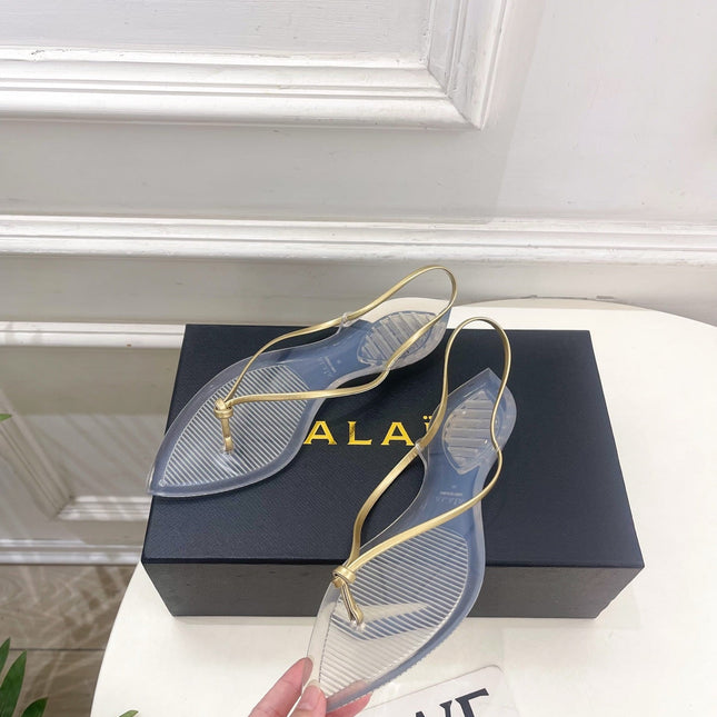 ALAIA 26S POINTED-TOE THONG SANDALS IN GOLD AND TRANSPARENT PVC