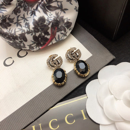 GUCCI 26S DOUBLE G LOGO BLACK CRYSTAL OVAL DROP EARRINGS IN ANTIQUE GOLD TONE METAL 6290262