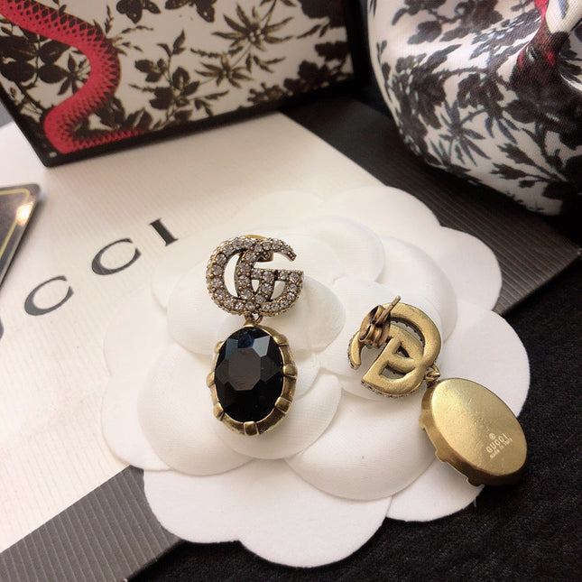 GUCCI 26S DOUBLE G LOGO BLACK CRYSTAL OVAL DROP EARRINGS IN ANTIQUE GOLD TONE METAL 6290262