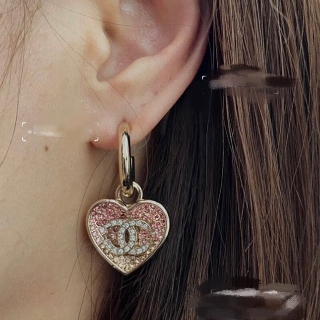 CHANEL 26S DOUBLE C LOGO TWO-TONE PAVE CRYSTAL HEART DROP HOOP EARRINGS IN GOLD METAL 631080
